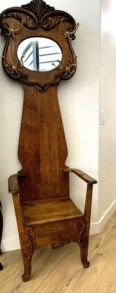 an old wooden chair sitting in front of a mirror