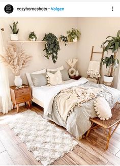 a bedroom with white walls and wooden floors