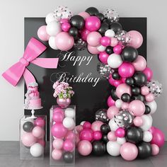 a pink and black birthday party with balloons