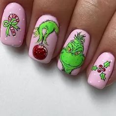 Add a playful twist to your holiday manicure with these fun and festive Christmas Press-On Nails! Designed in a cute short square shape, these pink stick-on nails feature quirky green-haired cartoon monsters alongside candy cane accents, bringing joy and creativity to your winter style. Perfect for women and girls who want a unique and easy holiday look, each set includes durable, full-cover nails that stick on in seconds. Get ready to make a statement this Christmas with these eye-catching, whimsical press-on nails! Grinch Nail Art Designs, Simple Grinch Nails, Grinch Nails Designs, Grinch Nail Art, Gnome Nails, Green Acrylics, Grinch Nails, Christmas Press On Nails, Holiday Manicure