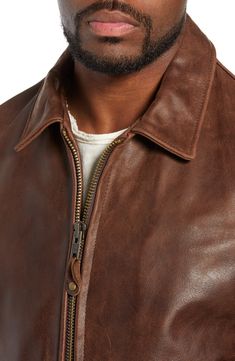 A high polish elevates the look of a full-grain leather jacket constructed with a soft cotton lining and shoulder-broadening sunray seaming on the back. Front zip closure Spread collar Angled welt pockets; interior pocket Adjustable side tabs with buckle closures Lined Buffalo leather Professional leather clean Made in the USA Classic Collared Leather Jacket With Zipper, Classic Collared Leather Jacket With Zipper Closure, Rugged Leather Outerwear For Spring, Classic Leather Outerwear With Contrast Stitching, Classic Leather Jacket With Contrast Stitching, Fall Leather Jacket With Contrast Stitching, Leather Jacket With Contrast Stitching For Spring, Classic Leather Jacket With Padded Collar For Spring, Spring Leather Jacket With Contrast Stitching