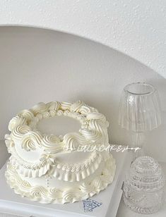 a white cake sitting on top of a table