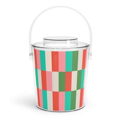 an ice bucket with a handle and colorful squares on the front, sitting against a white background