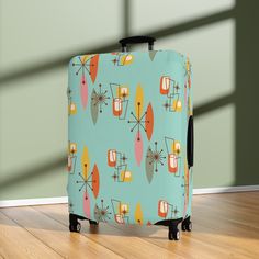 Zip through the terminal with our Boomerang Starburst Luggage Cover! Flaunting a mid-century design in teal with orange and pink accents, this cover gives your suitcase a groovy retro upgrade that's easy to spot on any luggage carousel. Protect luggage from nasty scratches and accidental swaps at the baggage carousel. These covers slide on quickly and feature multiple slits on the left side for easy access to the handles. Material: 95% polyester, 5% spandex: Constructed with an elastic polyester Retro Rectangular Cases With Luggage Sleeve, The Terminal, Groovy Retro, Luggage Cover, Orange And Pink, Pink Accents, Mid Century Design, Carousel, Mid-century Modern