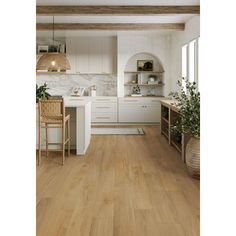 a kitchen with wood floors and white cabinets