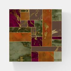 a square tile with many different colors and shapes