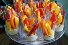 small cups filled with food sitting on top of a metal tray