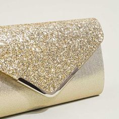 Sparkle your way through the season with this glittery clutch bag. This evening bag which is made of quality glitter material and exquisite hardware, cute looks, elegant envelope shape, smooth and soft touching, magnetic button closure, and one inside opening pocket.Width (cm): 5.5 cmHeight (cm): 13.5 Color: GoldMaterial_bag: PolyesterBagType: Clutch bag & Shoulder bagBag Length: 24 cm Party Envelope Bag With Magnetic Closure, Glitter Clutch Evening Bag For Events, Glitter Clutch Evening Bag For Event, Glitter Clutch Evening Bag, Chic Gold Evening Bag With Glitter, Chic Gold Glitter Evening Bag, Gold Glitter Evening Bag For Night Out, Chic Envelope Clutch For Party, Elegant Magnetic Closure Envelope Evening Bag