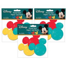 3 mickey mouse shaped dies with different colors and designs on them, each featuring the same