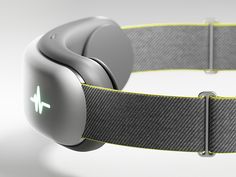 an electronic device that is attached to a belt with a green light on the side