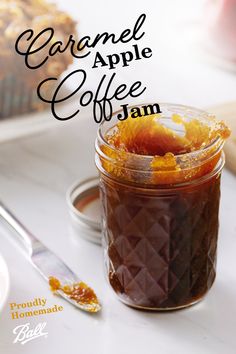 caramel apple coffee jam in a glass jar on a white table with a spoon