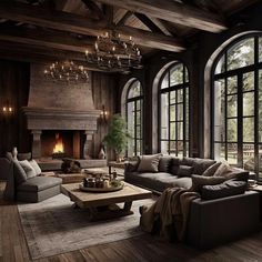 a living room filled with lots of furniture next to large windows and a fire place