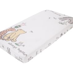 a baby crib mattress with winnie the pooh on it's back cover