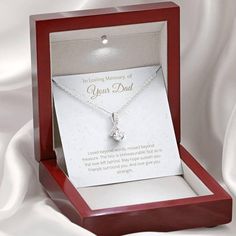 Melt her heart with this ALLURING BEAUTY necklace gift! The petite ribbon shaped pendant is finished with 14K white gold over stainless steel, and is embellished with dainty clear crystals surrounded by a sparkling 7mm round cut Cubic Zirconia. The adjustable cable chain allows the necklace to be worn at 18" to 22" in length. This necklace is one of our best sellers! Be sure to get yours NOW!Product Dimensions: • Height: 0.8" (20mm) x Width: 0.4" (10mm)• 7mm cubic zirconia • 18"-22" adjustable c I Carry Your Heart, Wife Necklace, Beauty Necklace, Birthday Gifts For Grandma, Sister Necklace, Best Friend Necklaces, Gift Ribbon, Ribbon Necklace, Daughter Necklace