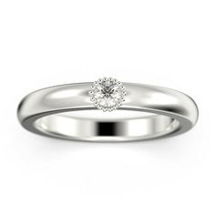 a white gold ring with a single diamond