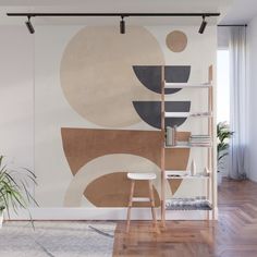 a living room with a large wall mural on the wall and a chair in front of it