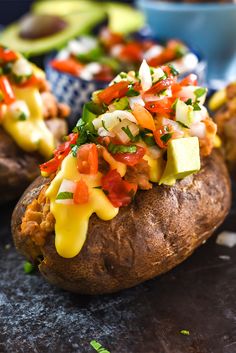 the baked potatoes are topped with colorful toppings