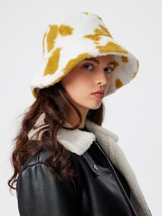 a woman wearing a black leather jacket and a yellow and white hat Trendy White Hat For Fall, Trendy Yellow Hats For Fall, Trendy Yellow Fall Hat, Trendy Yellow Fall Hats, White Bucket Hat For Fall, Trendy White Winter Bucket Hat, Trendy Cotton Bucket Hat For Winter, Winter Cotton Bucket Hat, Fuzzy Bucket Hat