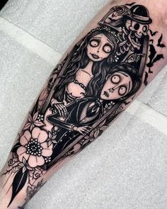 a black and white tattoo on the arm of a woman with two girls in her arms