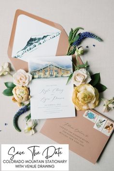 save the date cards and envelopes with flowers on them are displayed in front of an envelope