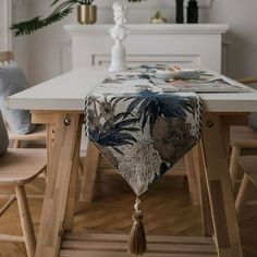 a dining room table with an animal print runner