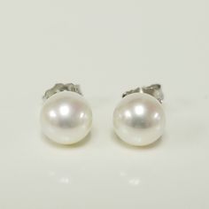 "Thanks for shopping our vintage estate store. We tend to sell well below wholesale and truly hope you enjoy all of our items. Many of the items are one of a kind, so please enjoy scrolling through the pictures and hopefully something will catch your eye. Brown spots are from camera. Nice estate 14k white gold natural pearl studs. Freshwater cultured pearls, custom made for our store. Size: 6mm 1/4\" Weight: .93 gram Earring backs are included. Freshwater pearls takes 4 to 6 years to be develope Classic White Gold Jewelry For Anniversary, Classic Anniversary Earrings With Polished Finish, Fine Jewelry Gift With Classic Design, Fine Jewelry With Classic Design As A Gift, Fine Jewelry With Classic Design For Gift, Classic Jewelry With Round Cut Design, Timeless Round Pearl Earrings As Gift, Classic Polished Earrings For Anniversary, Classic Polished Finish Earrings For Anniversary