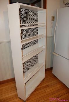 a white refrigerator freezer sitting inside of a kitchen