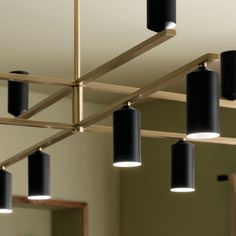 several lights hanging from the ceiling in a room