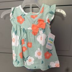 Floral Two Piece Set From Carters With A Ruffle Tank And Match Shorts New With Tags Orange Cotton Sets For Spring, Spring Cotton Set In Orange, Spring Season Orange Cotton Set, Spring Orange Cotton Set, Spring Playtime Orange Sets, Playful Floral Print Playtime Sets, Cute Floral Print Playwear Sets, Carters Puppy Pull String Blue, Floral Two Piece