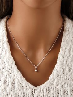 This teeny tiny teardrop necklace is made of 925 sterling silver. It makes a great necklace for everyday wear. This teardrop necklace includes: - tiny silver teardrop charm pendant (size 9x4mm | approx 3/8 inch - including the loop that is connected to the charm) - a rope, snake, anchor or curb chain (16 to 30 inches) - We recommend the anchor chain for this necklace, as it is very dainty. MATCHING EARRINGS: https://shorturl.at/NlsEH SILVER POLISHING CLOTH: https://etsy.me/3ieXQyh ADD INITIAL CH Delicate Teardrop Sterling Silver Charm Necklace, Delicate Sterling Silver Teardrop Pendant Charm Necklace, Dainty Sterling Silver Teardrop Charm Necklace, Dainty Teardrop Sterling Silver Charm Necklace, Sterling Silver Charm Necklace With Teardrop Pendant, Silver Teardrop Charm Necklace In Dainty Style, Sterling Silver Teardrop Charm Necklace With Delicate Chain, Sterling Silver Teardrop Pendant Charm Necklace With Delicate Chain, Silver Dainty Drop Charm Necklace