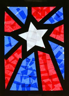 a stained glass window decorated with red, white and blue stars