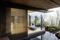 the inside of a house with water and rocks