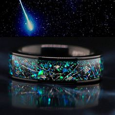 Meteorite Ring, Wood Ring, Damascus Ring, Antler Ring, Camo Ring, Opal Ring, Cubic Zirconia, Turquoise Ring, & Wedding Rings. Check out our selection here: https://www.etsy.com/shop/KingswayJewelry This unique ring beats any conventional ring. Perfect for anyone looking for a unique ring or wedding band that will constantly turn heads. The wedding band decorated with natural blue and green opal and Genuine Muonionalusta Meteorite chips. Bands' width - 7 mm THE PERFECT FIT Comfort Fit rings have Camo Rings, Meteorite Wedding Band, Opal Wedding Band, Stainless Steel Wedding Ring, Damascus Ring, Antler Ring, Black Tungsten Rings, Opal Band, Meteorite Ring