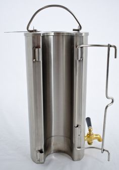 a stainless steel beverage dispenser on a white background