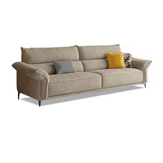 a beige couch with two pillows on it