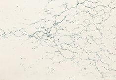 a white marble textured background with blue speckles