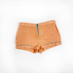 -SO SO CUTE  -1970s JC Pennys orange terrycloth hot shorts  -contrast blue exposed zipper  -cute contrast stitching details  -no flaws to note -would best fit a medium, marked a size medium -75% cotton 25% polyester  MEASUREMENTS waist: 15 inches flat hips: 19 inches flat length: 10.5 inches  inseam: 2 inches  rise: 11.5 inches Retro Stretch Bottoms With Built-in Shorts, Stretch High Waist Shorts With Zipper Closure, Retro Stretch Bottoms Short Length, Retro Stretch Bottoms In Short Length, Stitching Details, Hot Shorts, Exposed Zipper, Terry Cloth, Short Outfits