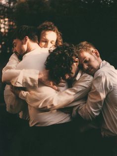 a group of men hugging each other