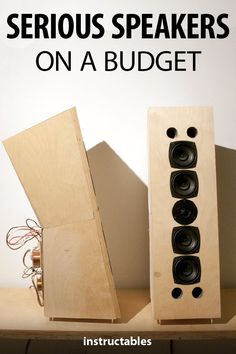 two speakers sitting on top of a wooden shelf with text overlay that reads serious speakers on a budget