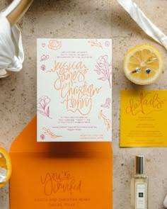 an orange and yellow wedding suite with matching stationery