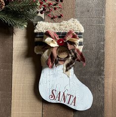 a christmas stocking hanging on a wooden wall