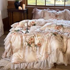 the comforter is made up with ruffles and flowers