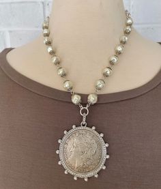 Silver Dollar Reproduction Coin Necklace, Coin Necklace With Pearls, - Etsy Silver Necklaces With Coin Pendant For Vintage Collection, Vintage Silver Jewelry With Pearl Charm, Silver Medallion Jewelry With Pearl Chain, Antique Silver Jewelry With Pearl Drop, Silver Medallion Necklace With Pearl Charm, Vintage Silver Jewelry With Pearl Chain, Antique Silver Pearl Jewelry, Vintage Silver Necklace With Pearl Chain, Vintage Silver Pearl Necklaces