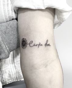 a woman's arm with a tattoo that says carppie dan on the side