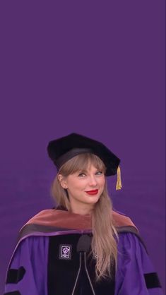 taylor swift wearing a graduation gown and holding a microphone in front of a purple background