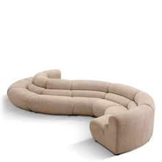 the curved couch is made out of beige fabric