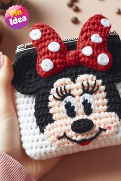 a crocheted minnie mouse purse is shown