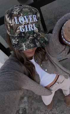 Preorder tees and sweatshirts ship out within 2-12 business days and preorder hats can take up to 15 business days to ship.   Camo is the new pink! Rock this trendy camo trucker hat this Valentine's Day - we can guarantee your guy will think it's the coolest.   ALL HATS ARE FINAL SALE! Trucker Hat Outfit, Girl Valentines, Girl Trucker, Custom Trucker Hats, Lover Girl, Camo Girl, Cowgirl Outfits