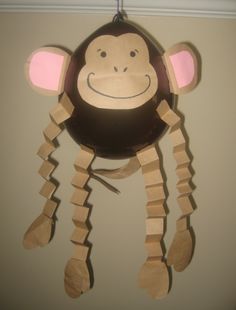 a paper monkey hanging from the ceiling