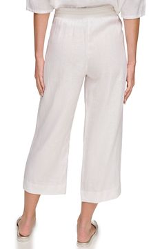 Kick back in casual-cool style in lightweight linen pants topped with a drawstring waist and cut to a cropped length. 24" inseam; 21" leg opening; 13" front rise; 16 1/2" back rise (size Medium) Elastic/drawstring waist Side-seam pockets 100% linen Machine wash, tumble dry Imported Relaxed Fit Wide-leg Summer Capris, Spring Daywear Cropped Leg Bottoms, Relaxed Cropped Leg Bottoms For Spring, Wide Leg Relaxed Fit Summer Capris, Summer Wide Leg Relaxed Fit Capris, Wide Leg Relaxed Fit Capris For Summer, Cropped Leg Spring Daywear Bottoms, Casual Cropped Leg Bottoms For Daywear, Casual Cropped Bottoms For Daywear